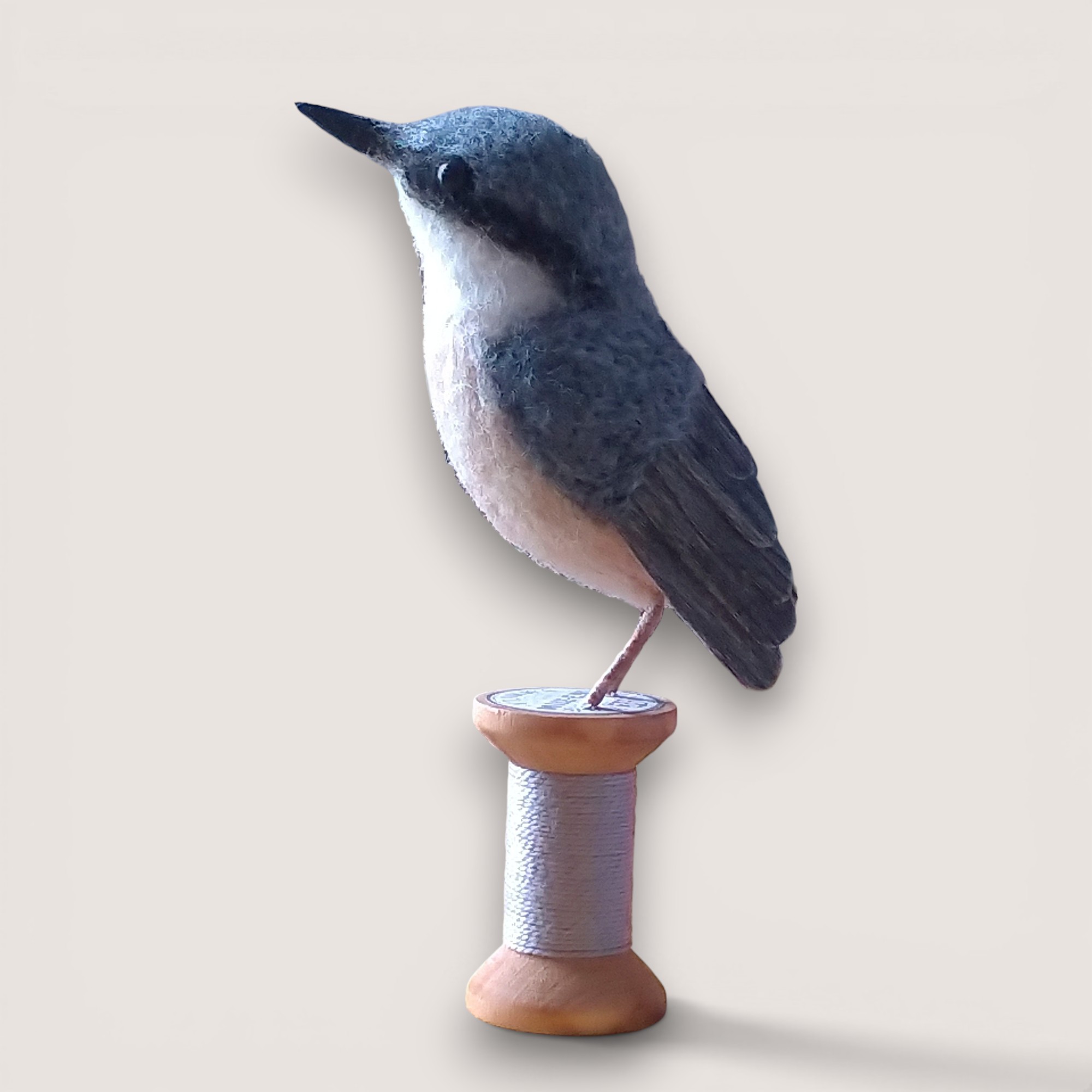 Needle felted nuthatch on wooden bobbin, handmade wool sculpture by Grey Wren Studio